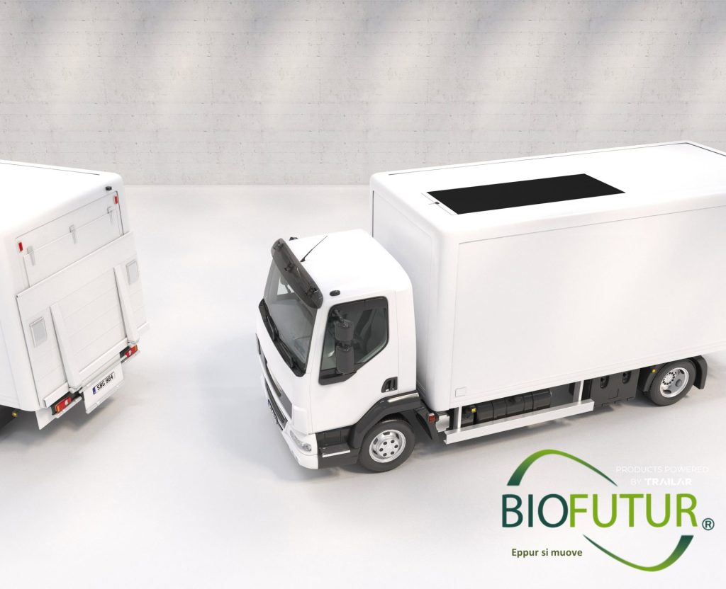 Camión con paneles solares sobre un fondo blanco artificial y el logo de Biofutur.